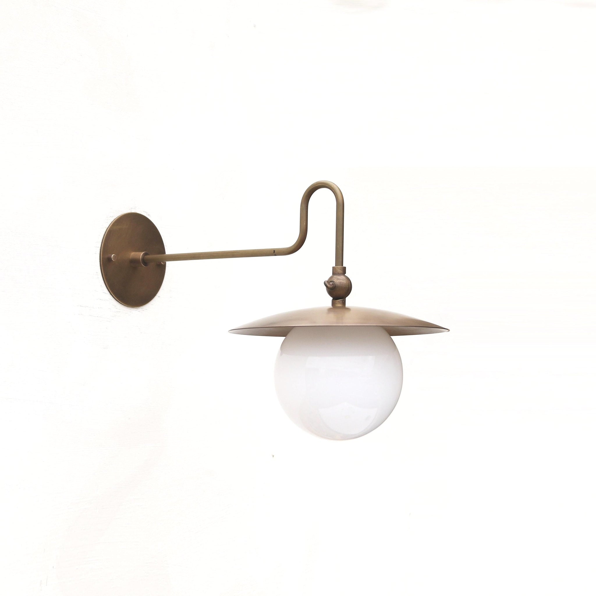 One-Light Brass Dish Wall Sconce with Curved Arm and Milk Glass Shade