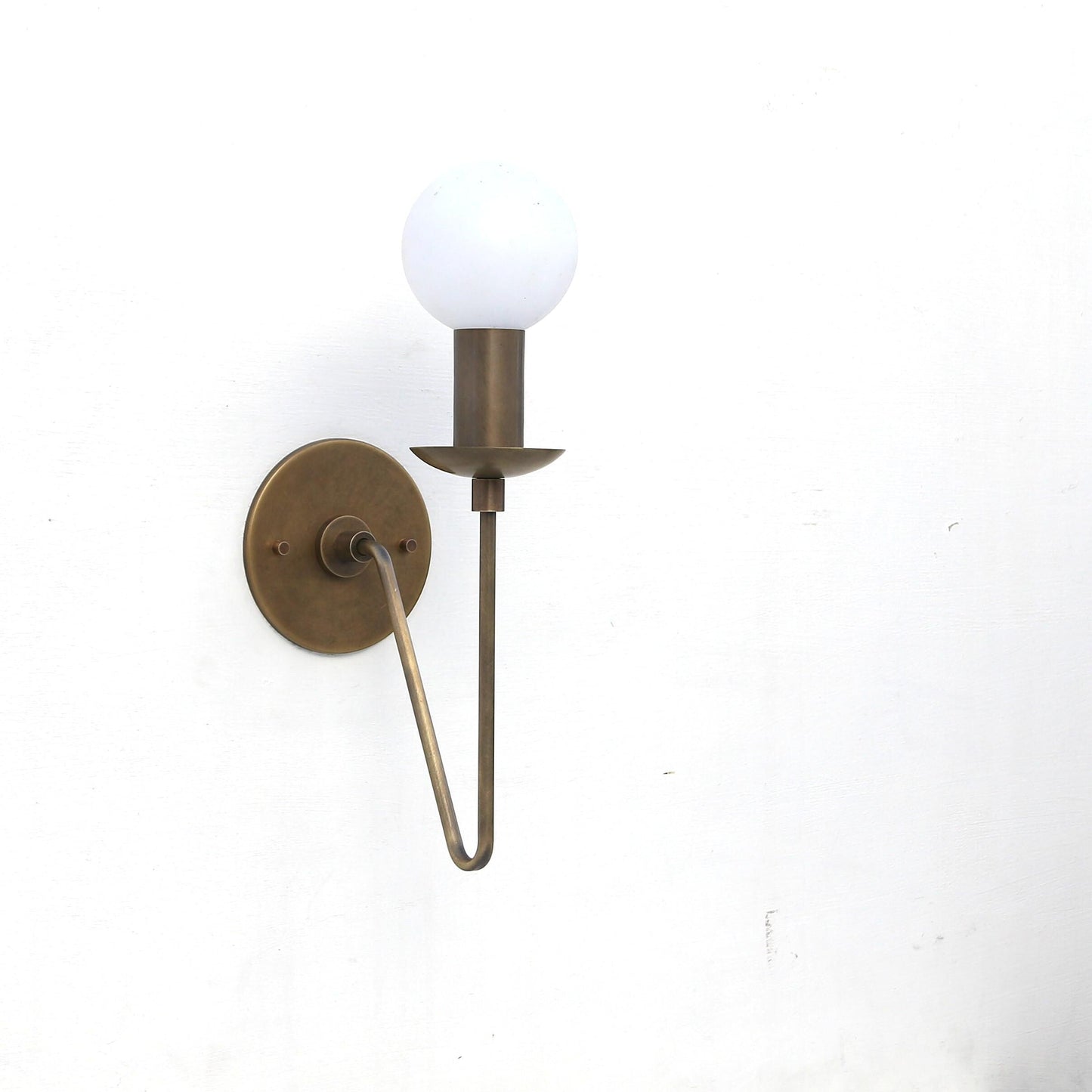 One-Light Brass Sconce with Curved Arm and Opal Glass Globe