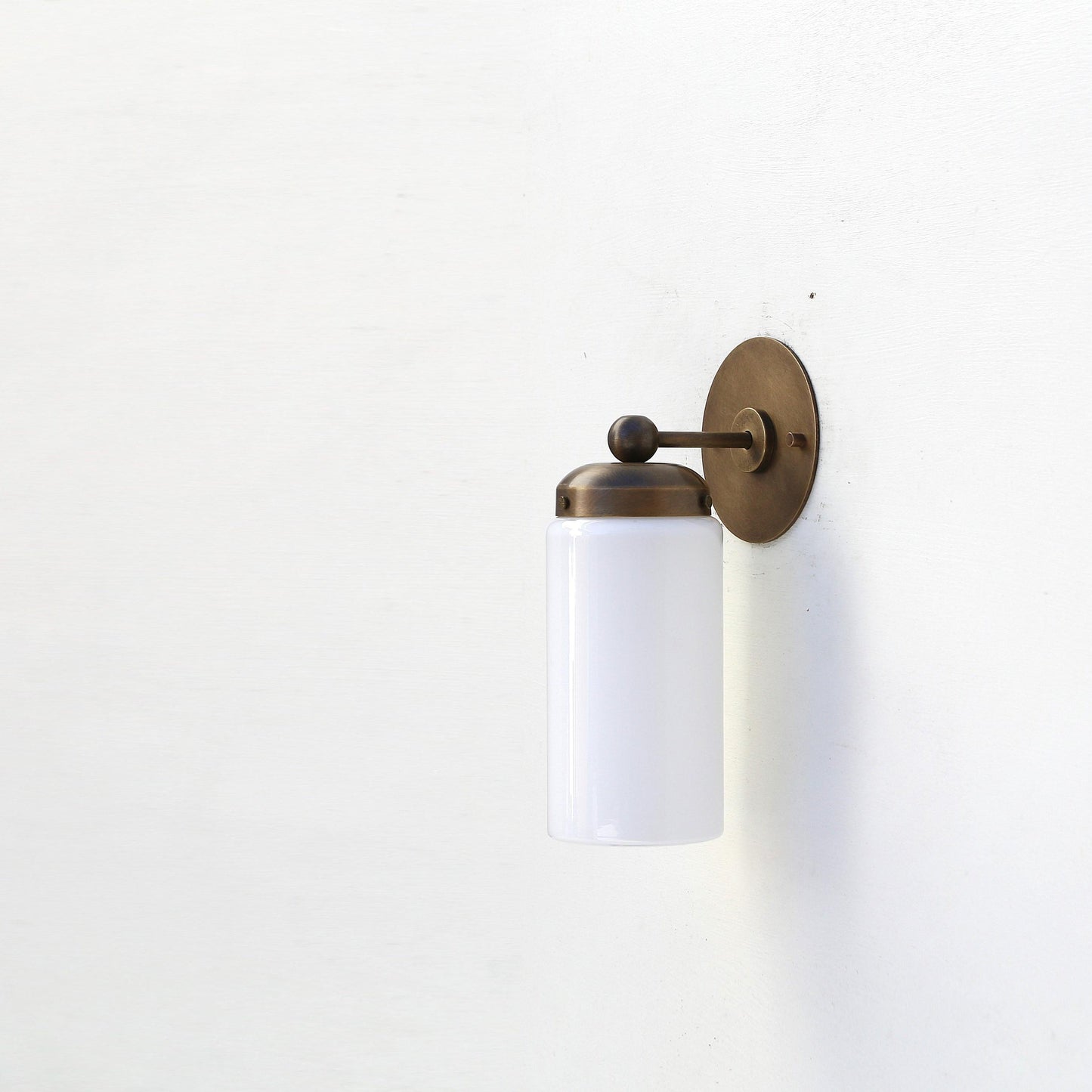 One-Light Brass Wall Sconce with Opal Glass Cylinder Shade