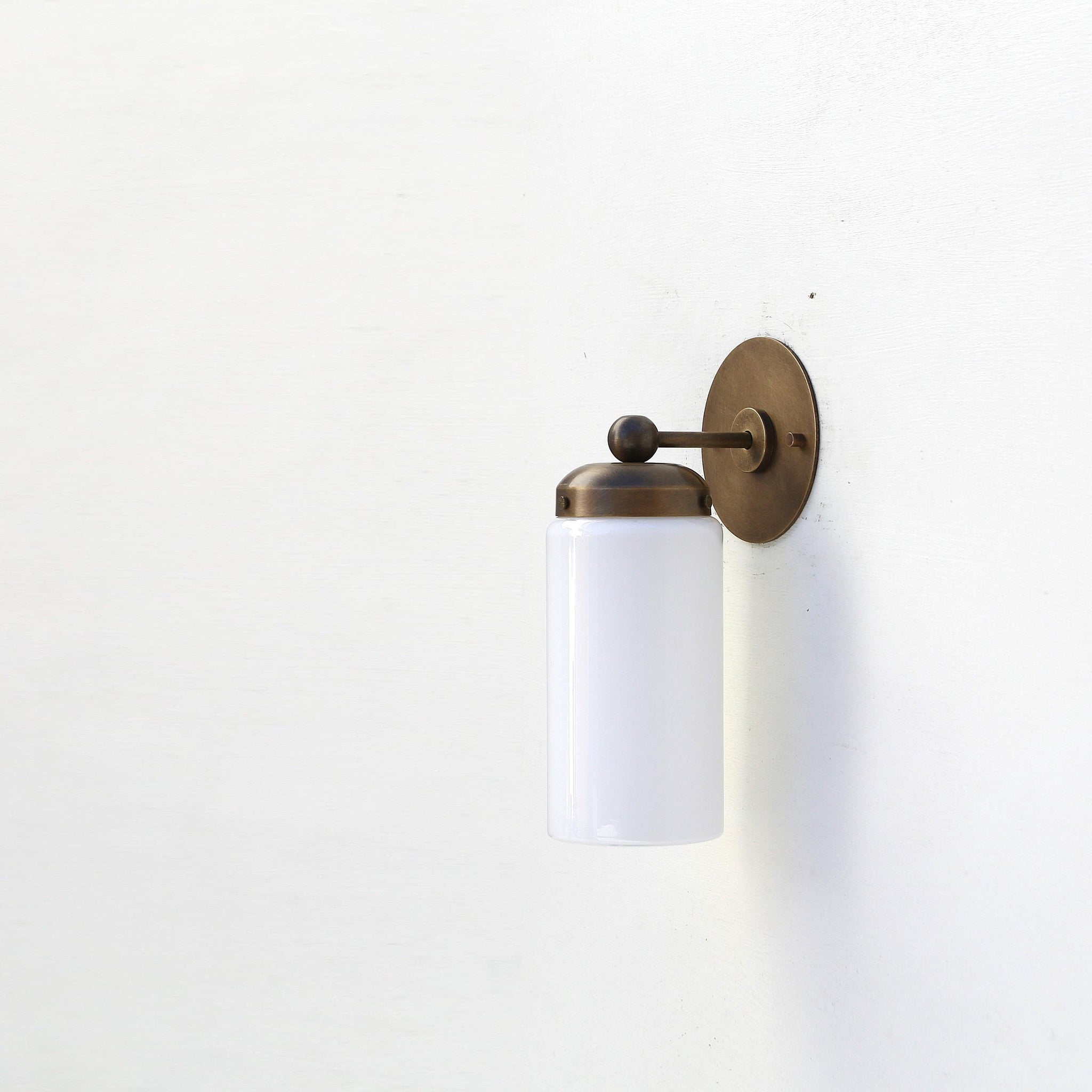 One-Light Brass Wall Sconce with Opal Glass Cylinder Shade