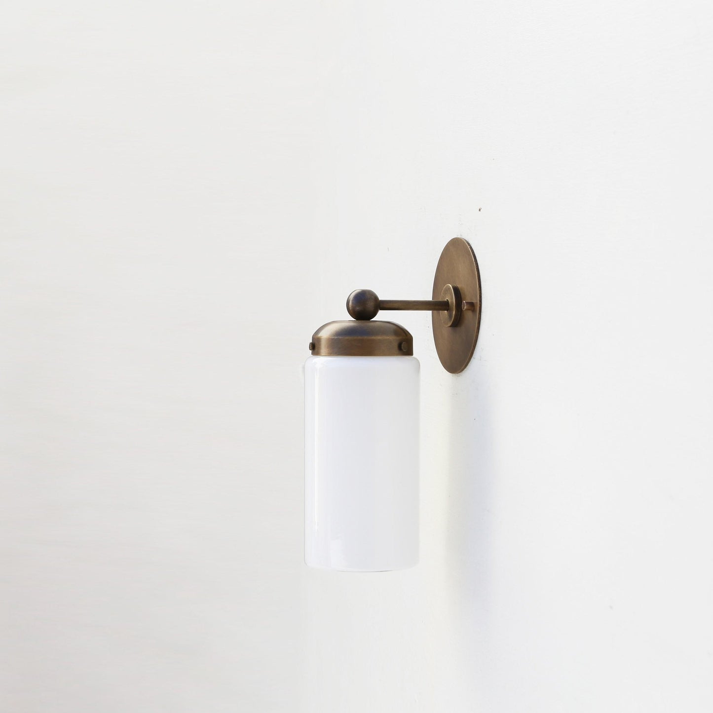 One-Light Brass Wall Sconce with Opal Glass Cylinder Shade