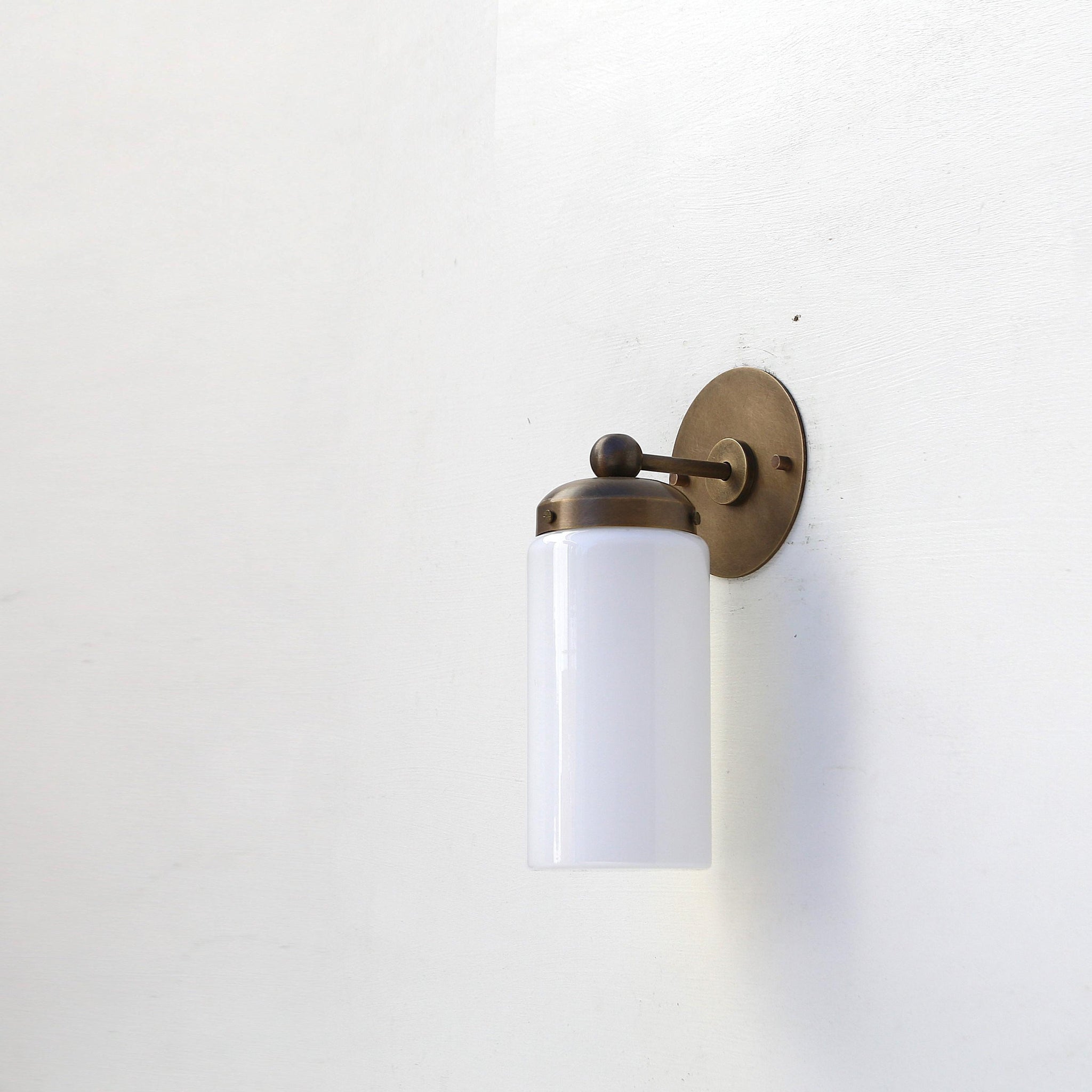 One-Light Brass Wall Sconce with Opal Glass Cylinder Shade