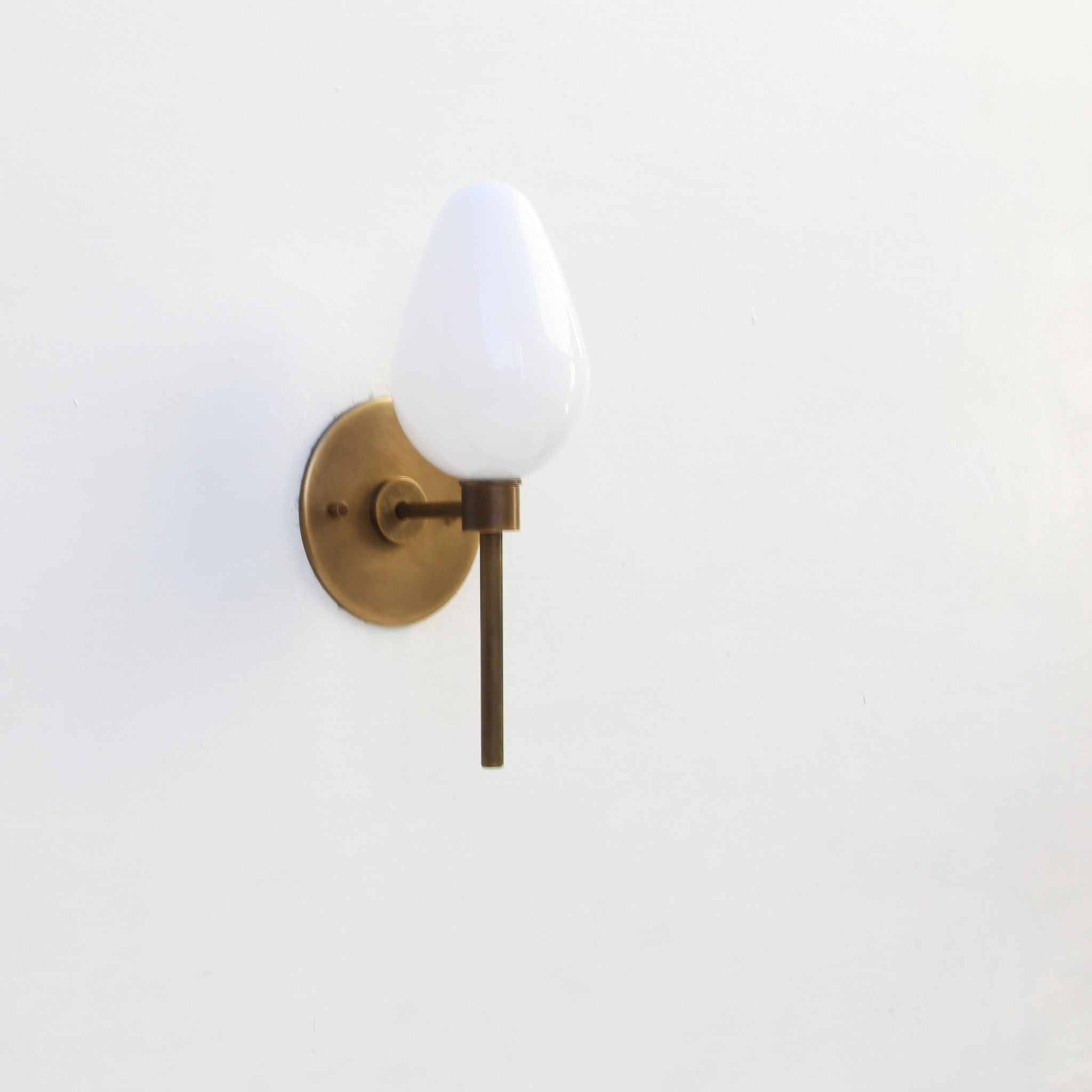 One-Light Brass Wall Sconce with Opal Tulip Shade