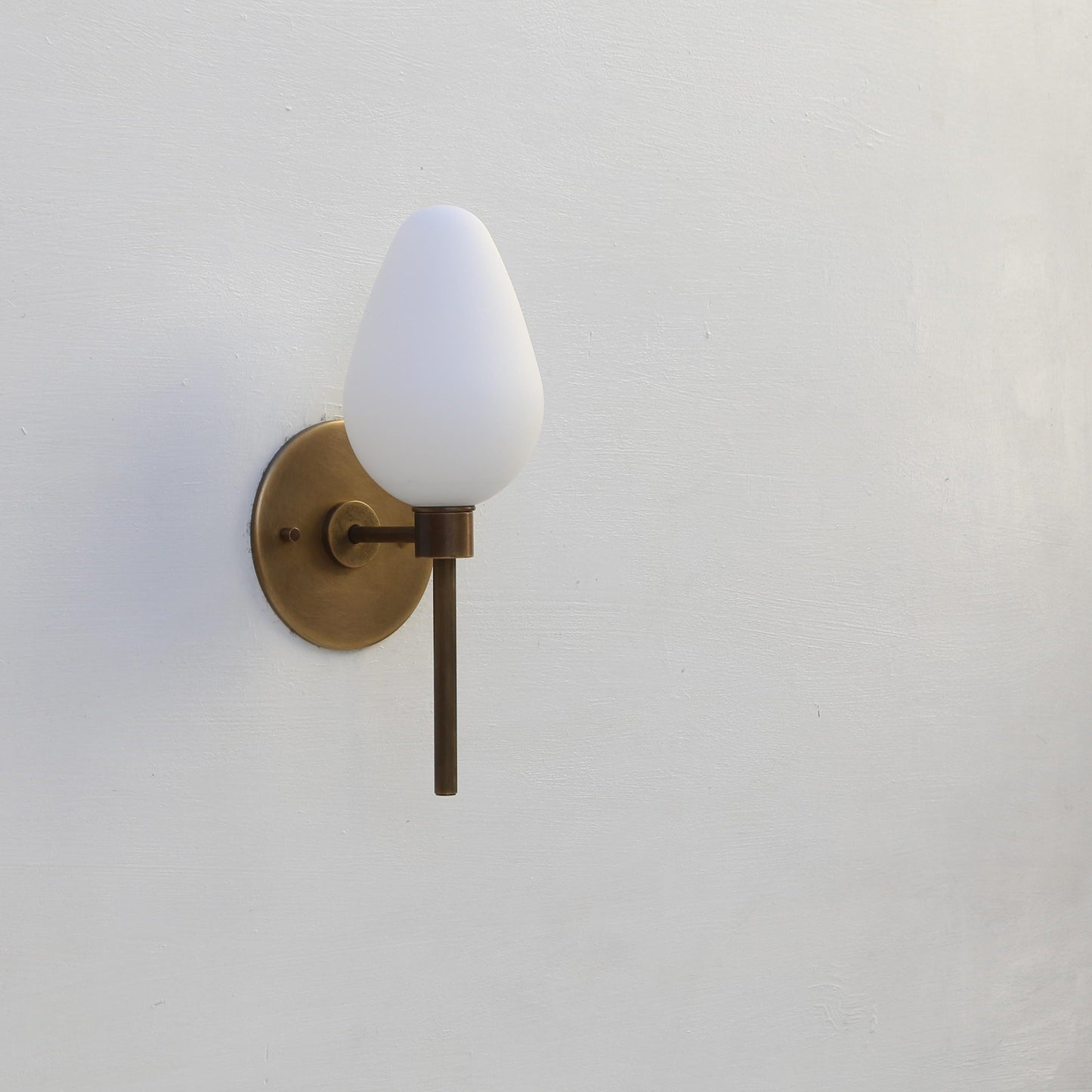 One-Light Brass Wall Sconce with Opal Tulip Shade