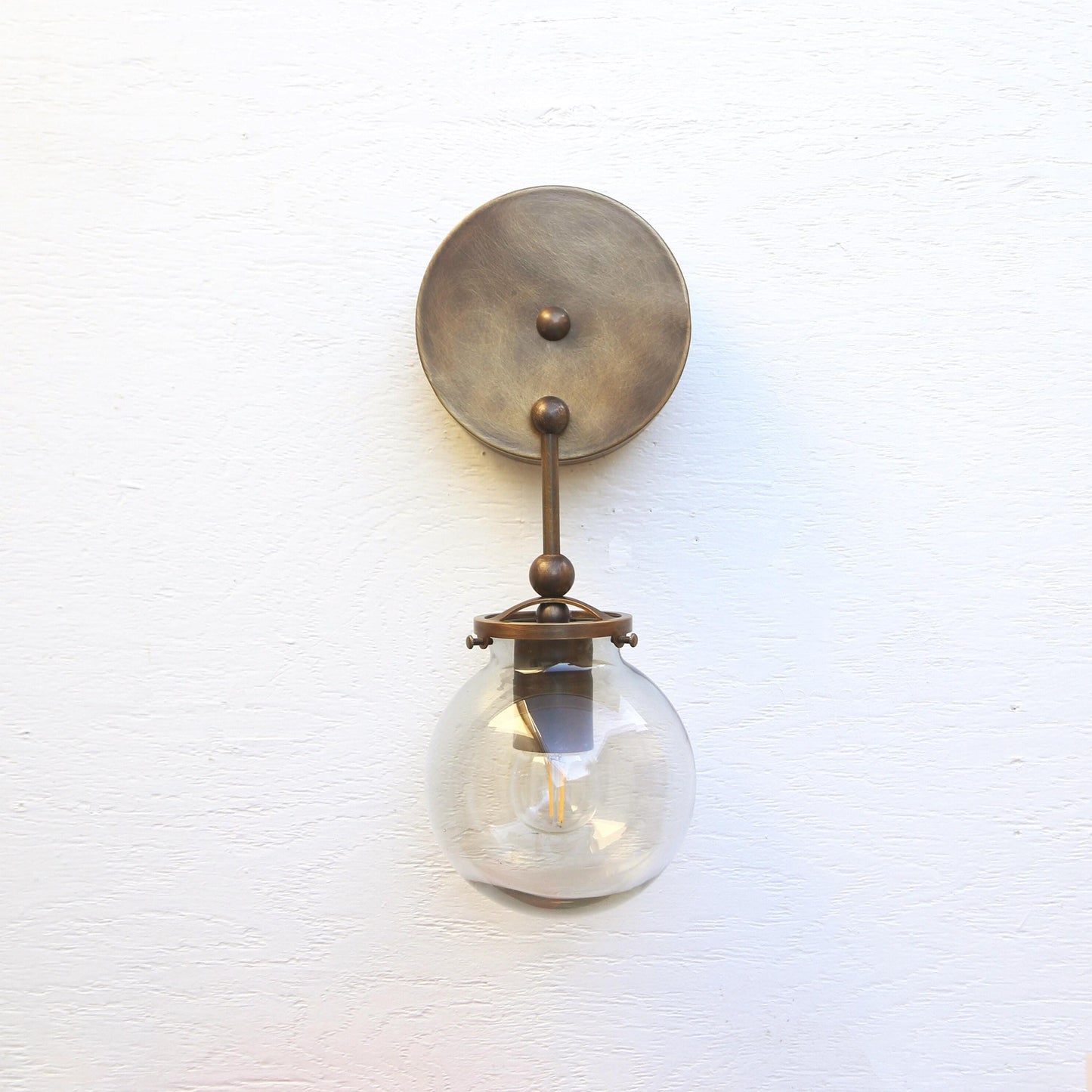 One-Light Brass Wall Sconce with Smoked Glass Globe