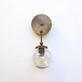 One-Light Brass Wall Sconce with Smoked Glass Globe