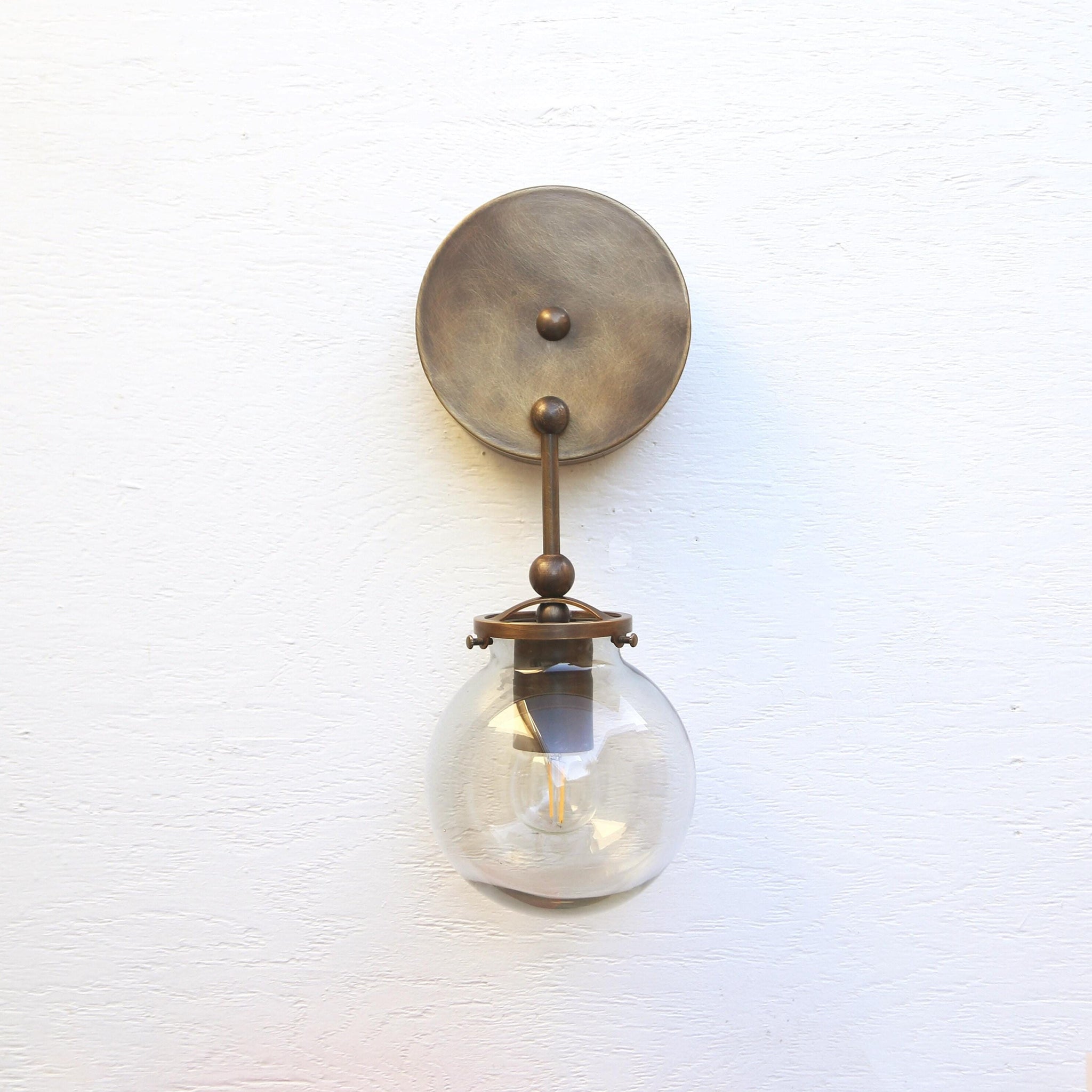 One-Light Brass Wall Sconce with Smoked Glass Globe