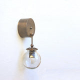 One-Light Brass Wall Sconce with Smoked Glass Globe