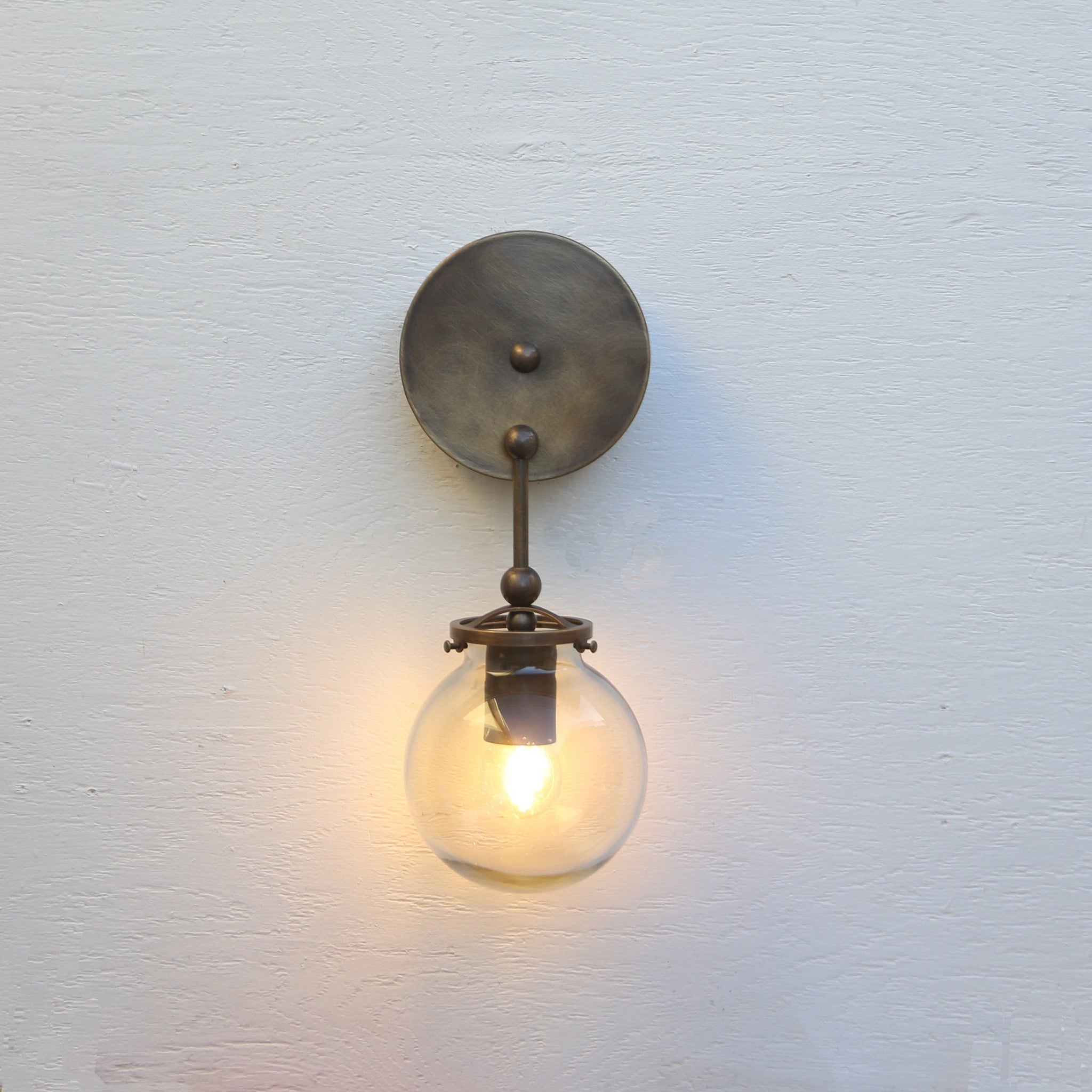 One-Light Brass Wall Sconce with Smoked Glass Globe