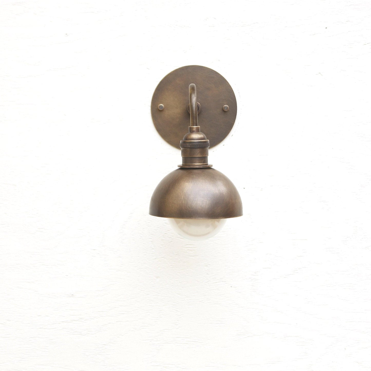 One-Light Curved Arm Wall Sconce with Brass Dome Shade