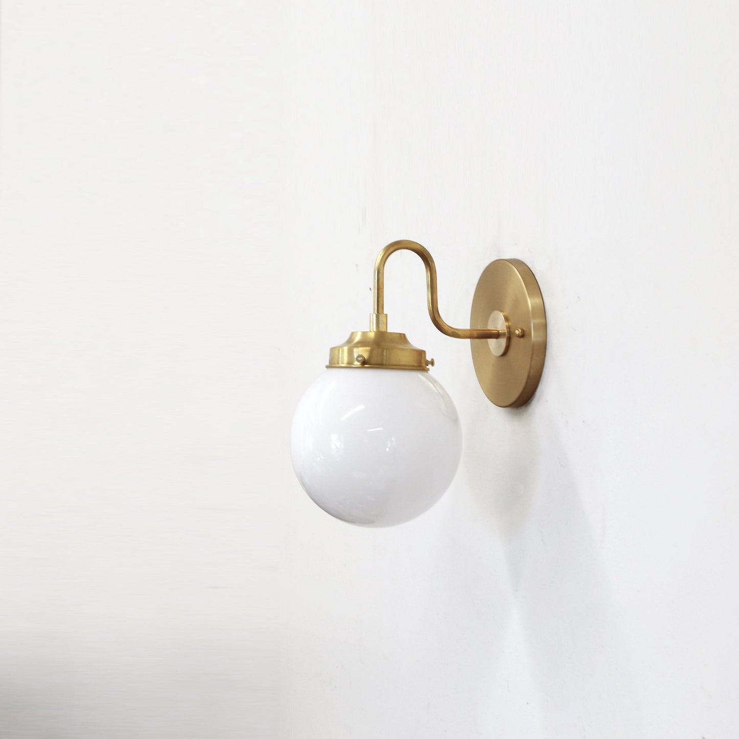 One-Light Curved Arm Wall Sconce with Opal Glass Globe