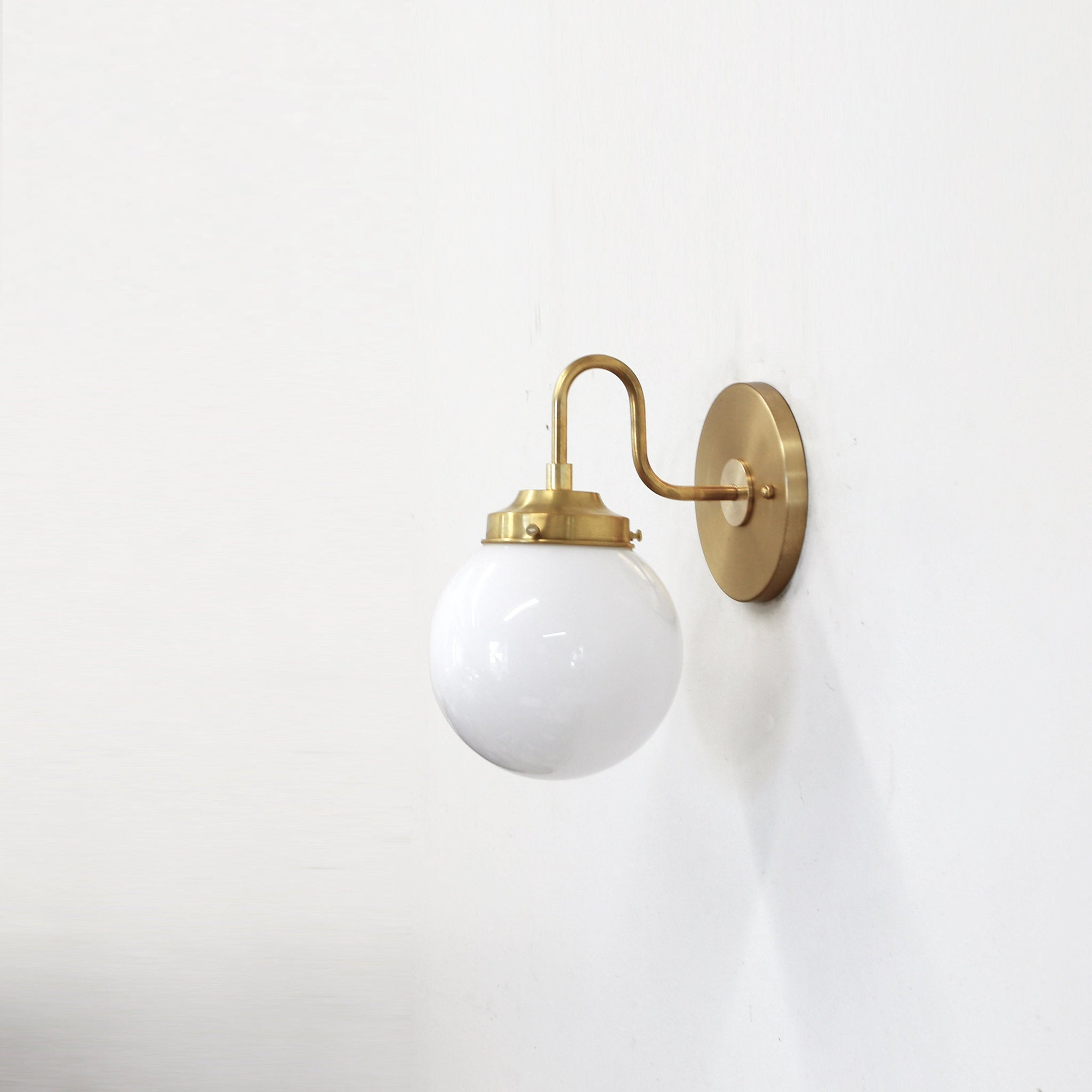 One-Light Curved Arm Wall Sconce with Opal Glass Globe