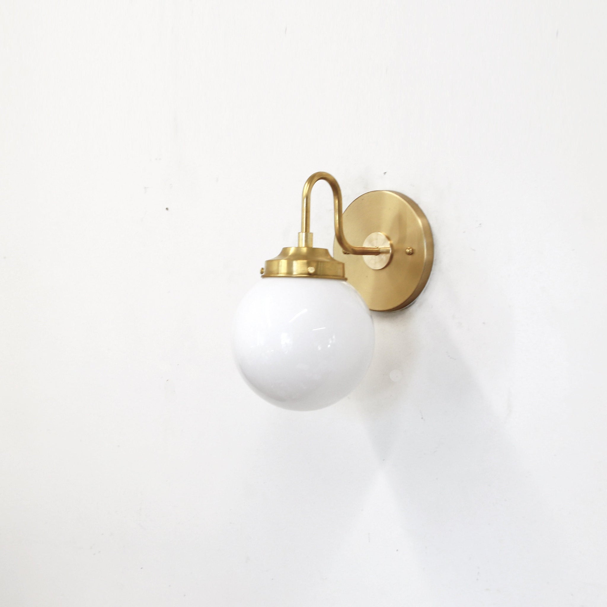 One-Light Curved Arm Wall Sconce with Opal Glass Globe