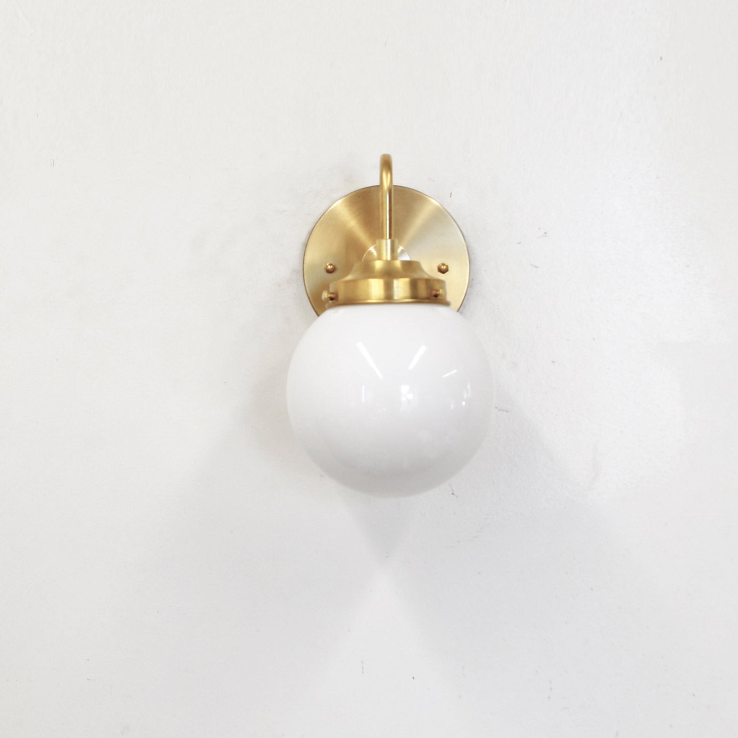 One-Light Curved Arm Wall Sconce with Opal Glass Globe