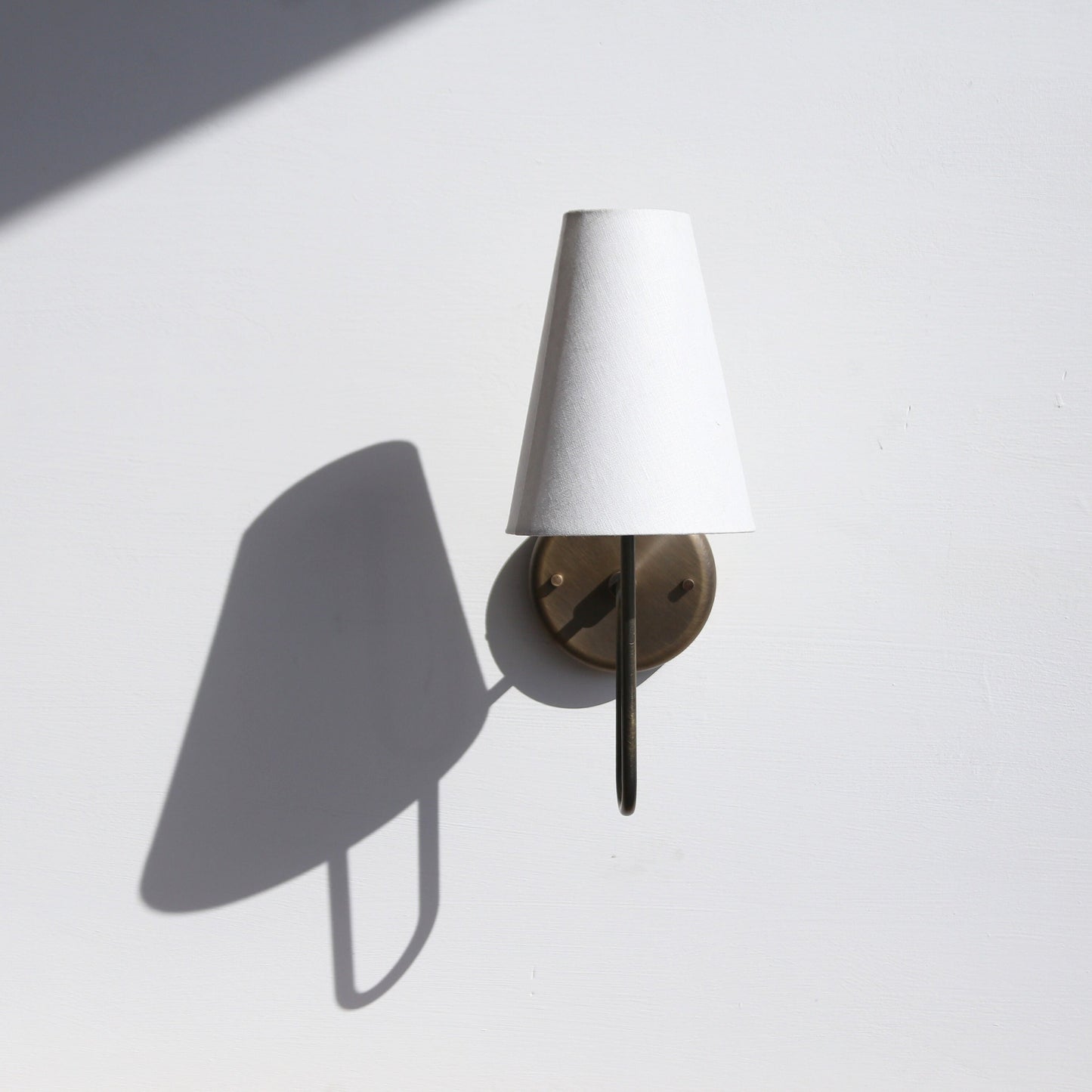 One-Light Linen Shade Wall Sconce with Curved Brass Arm