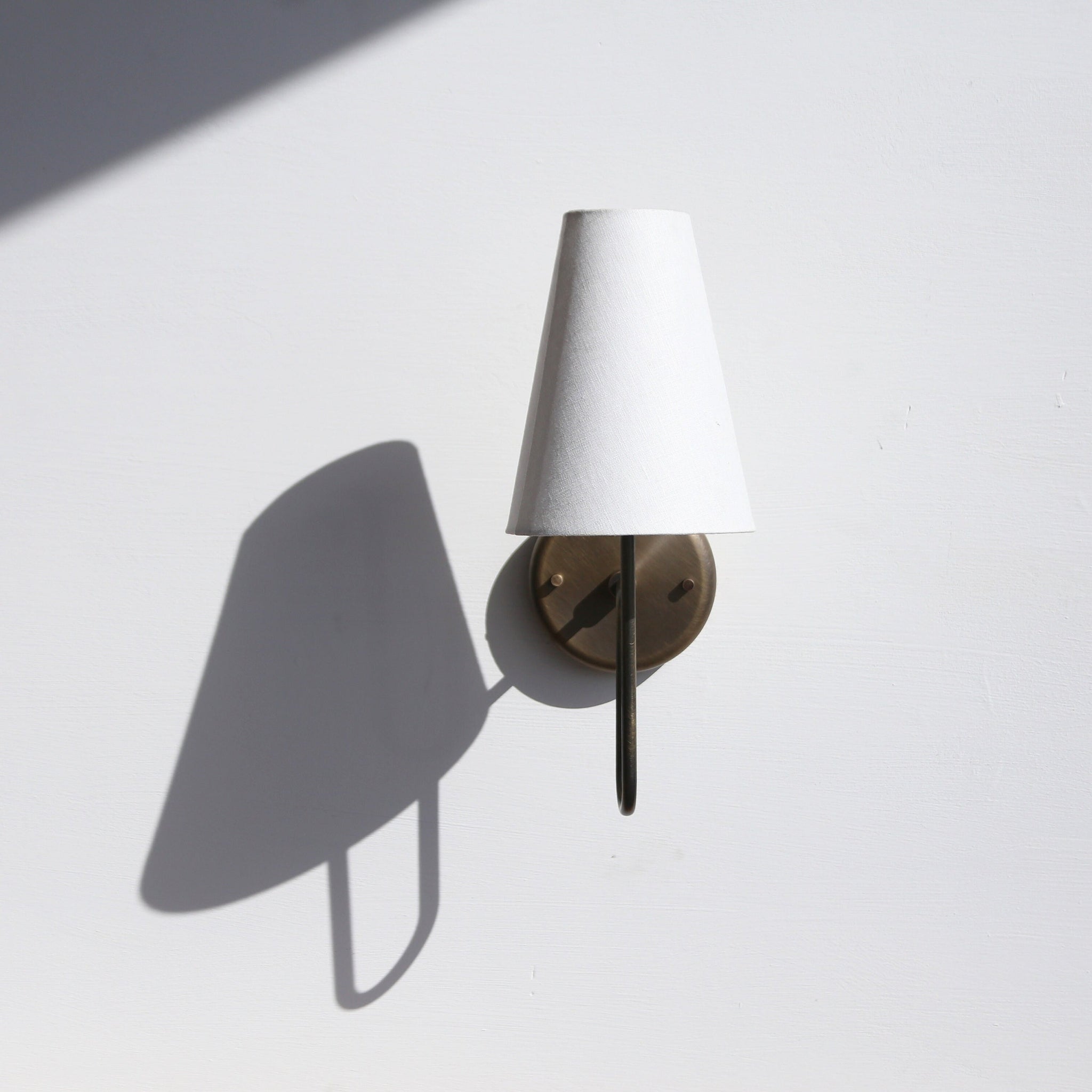 One-Light Linen Shade Wall Sconce with Curved Brass Arm