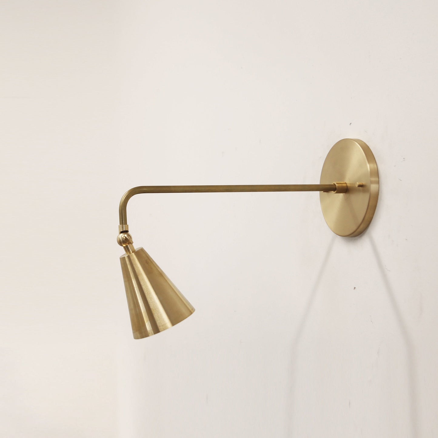 One-Light Long Arm Wall Sconce with Small Brass Cone