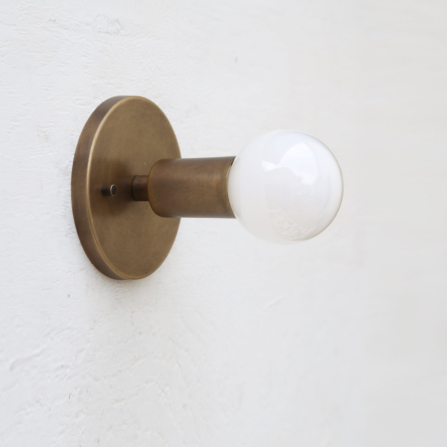 One-Light Minimal Brass Wall Sconce with Exposed Bulb