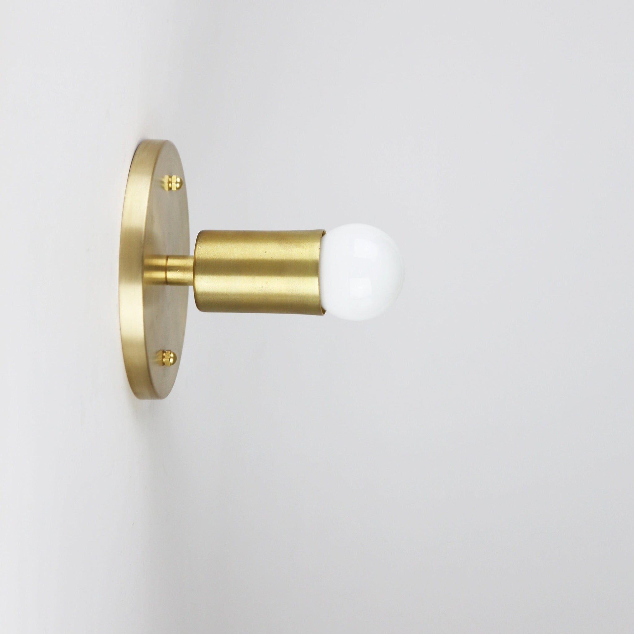 One-Light Minimal Brass Wall Sconce with Exposed Bulb