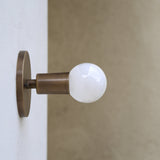 One-Light Minimal Brass Wall Sconce with Exposed Bulb