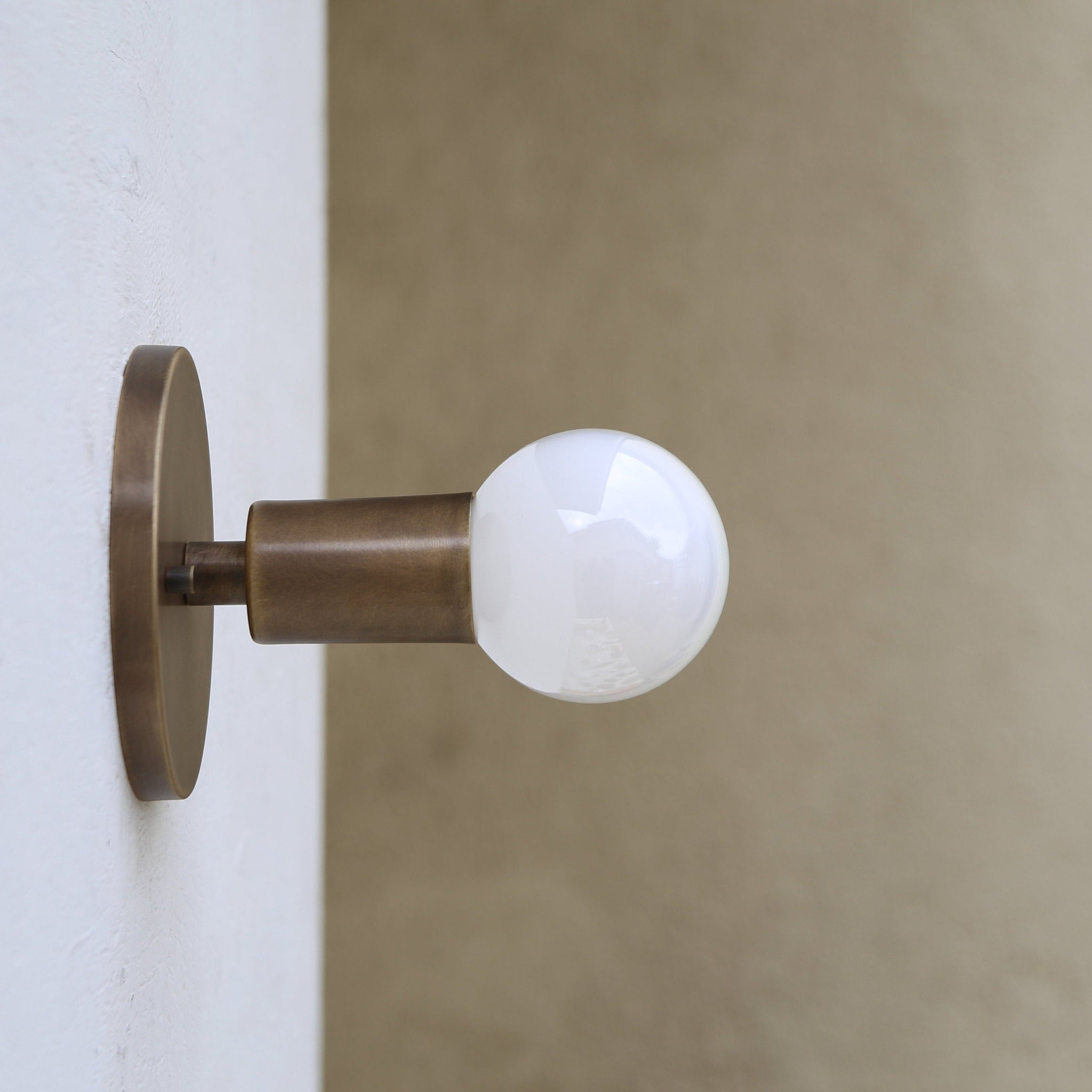 One-Light Minimal Brass Wall Sconce with Exposed Bulb