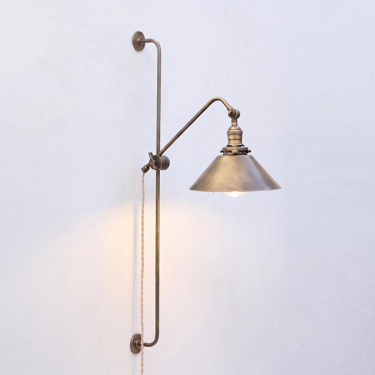 One-Light Plug-In Sliding Rail Wall Sconce with Brass Cone