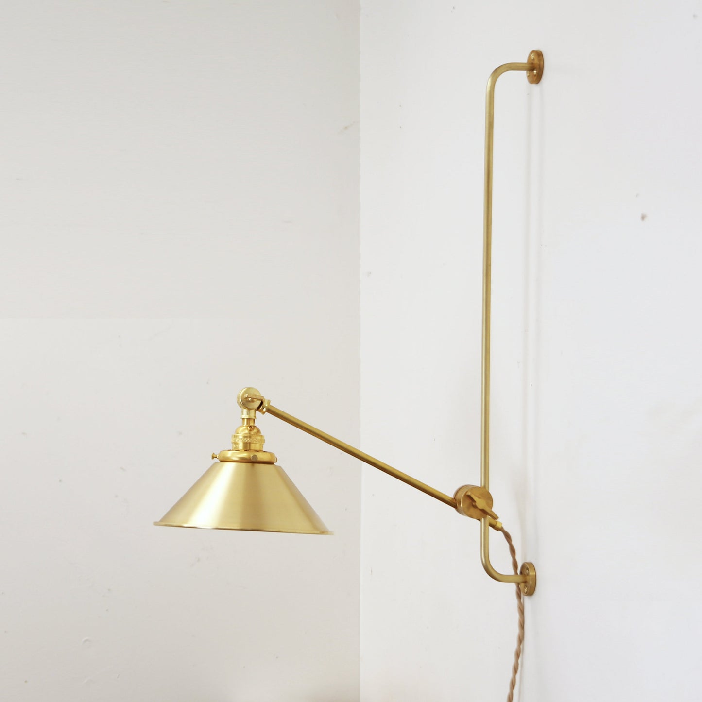 One-Light Plug-In Sliding Rail Wall Sconce with Brass Cone