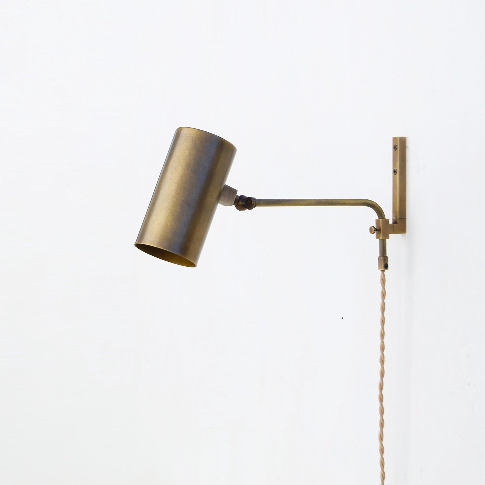 One-Light Plug-In Wall Sconce with Adjustable Brass Cylinder