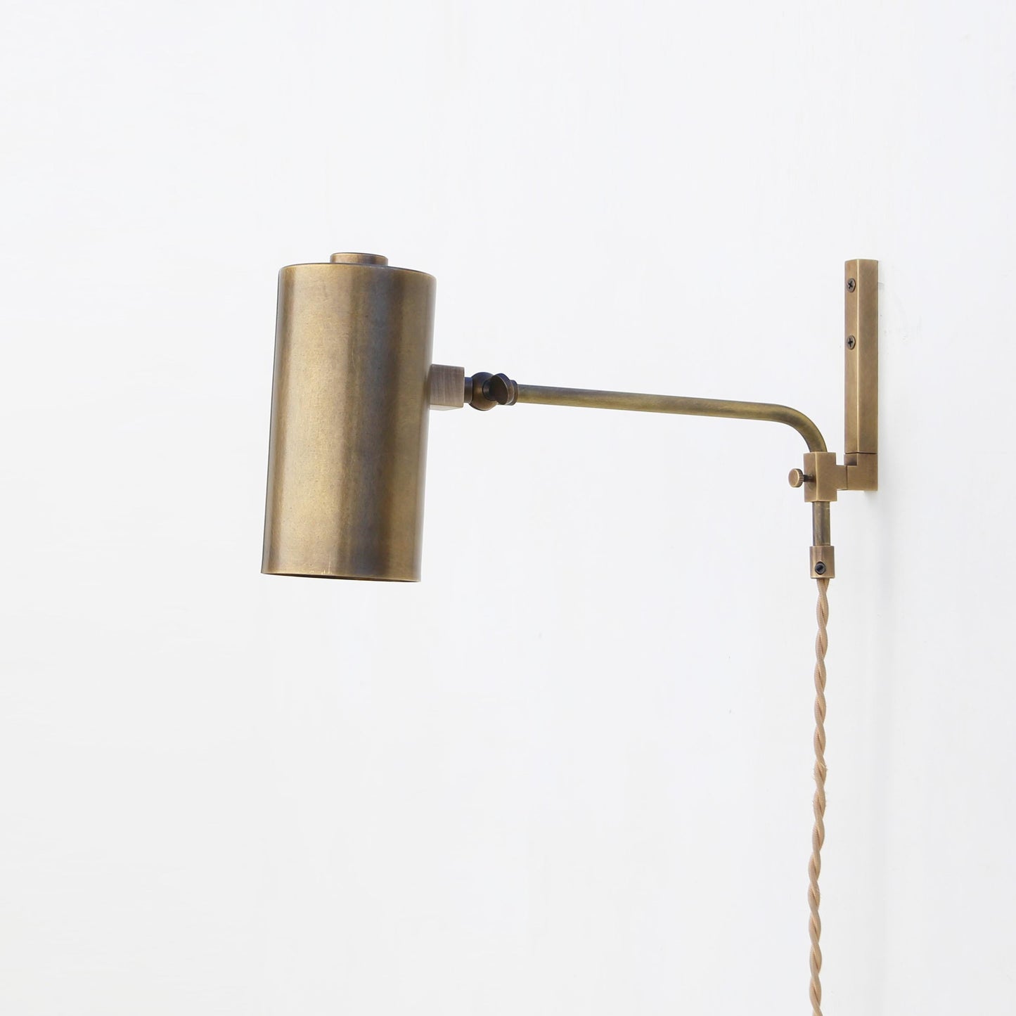 One-Light Plug-In Wall Sconce with Adjustable Brass Cylinder