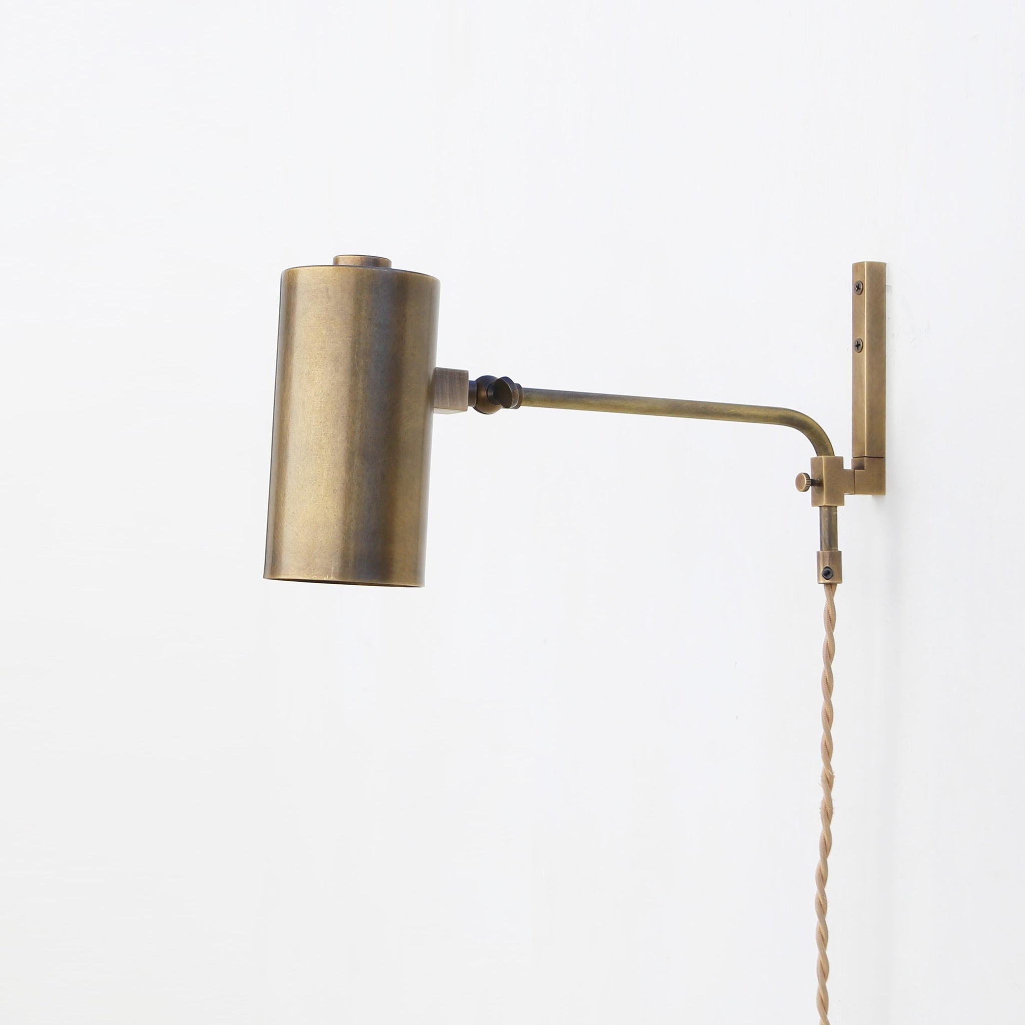 One-Light Plug-In Wall Sconce with Adjustable Brass Cylinder