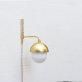 One-Light Plug-In Wall Sconce with Brass Cap and Opal Globe