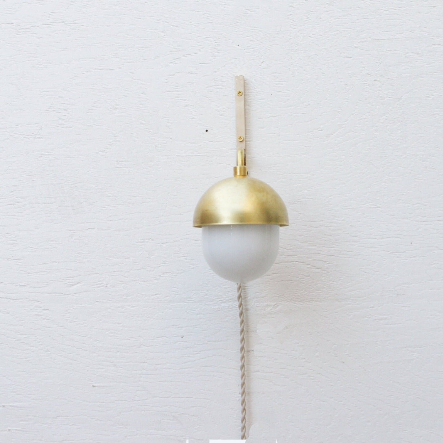One-Light Plug-In Wall Sconce with Brass Cap and Opal Globe