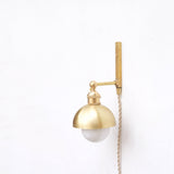 One-Light Plug-In Wall Sconce with Brass Dome Shade
