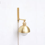 One-Light Plug-In Wall Sconce with Brass Dome Shade
