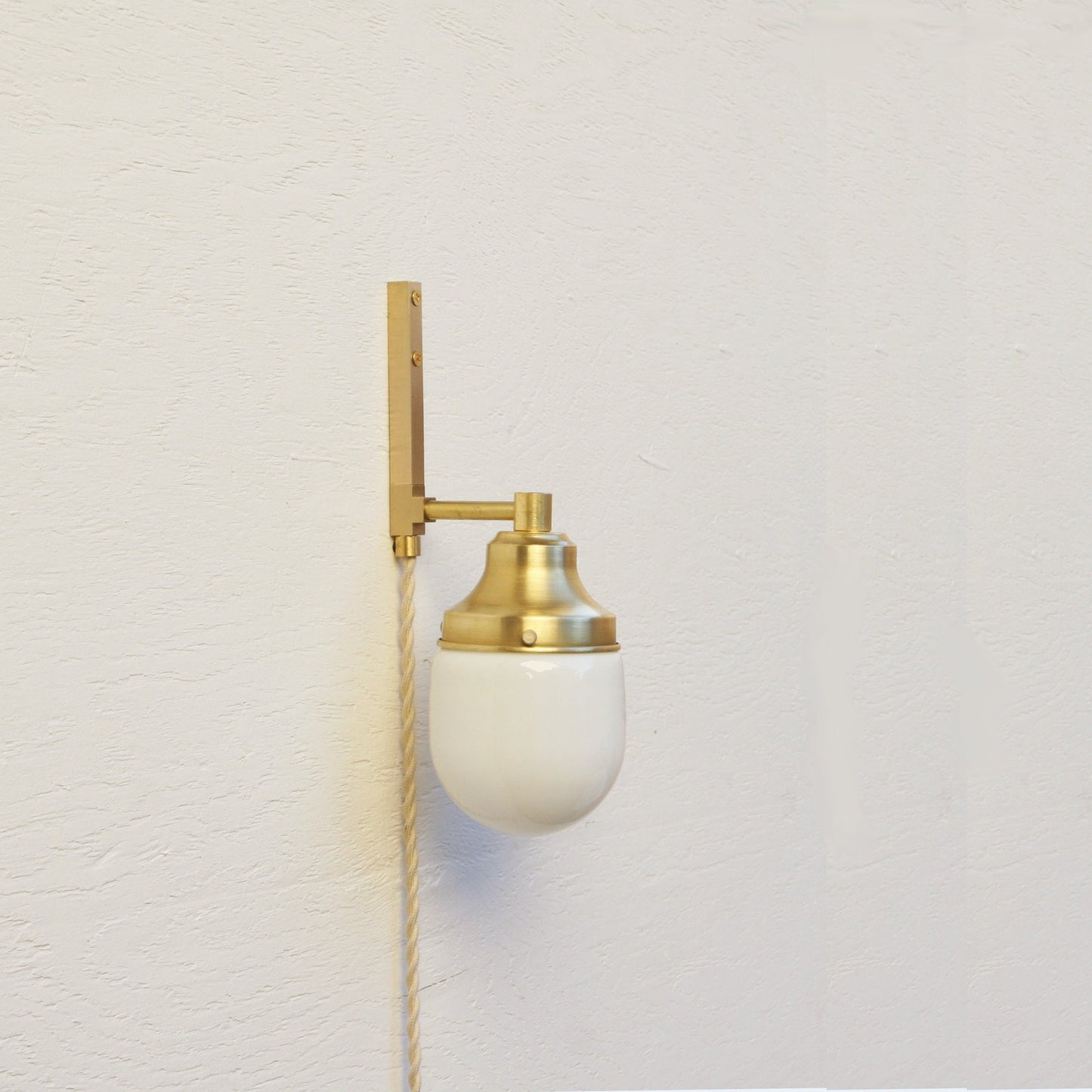 One-Light Plug-In Wall Sconce with Opal Glass Shade