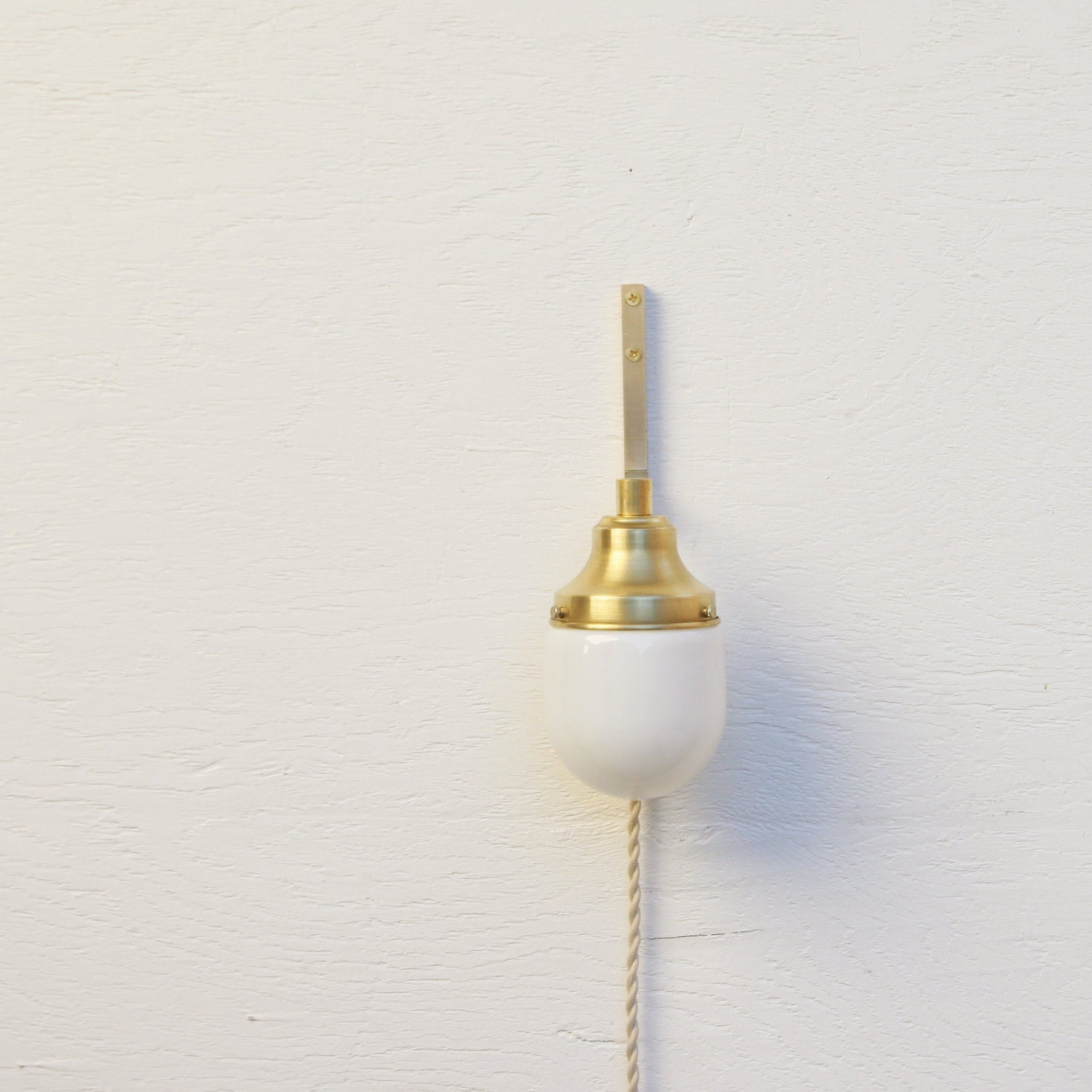 One-Light Plug-In Wall Sconce with Opal Glass Shade