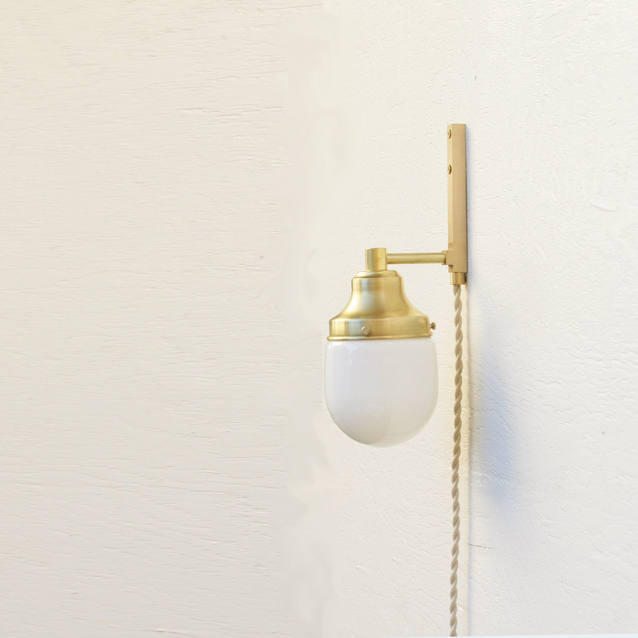 One-Light Plug-In Wall Sconce with Opal Glass Shade