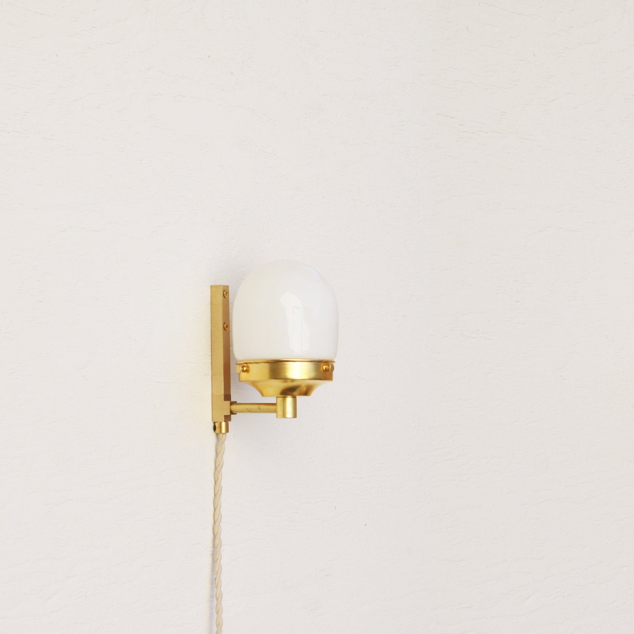 One-Light Plug-In Wall Sconce with Opal Glass Shade
