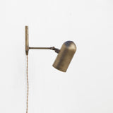 One-Light Plug-In Wall Sconce with Pivoting Brass Cylinder