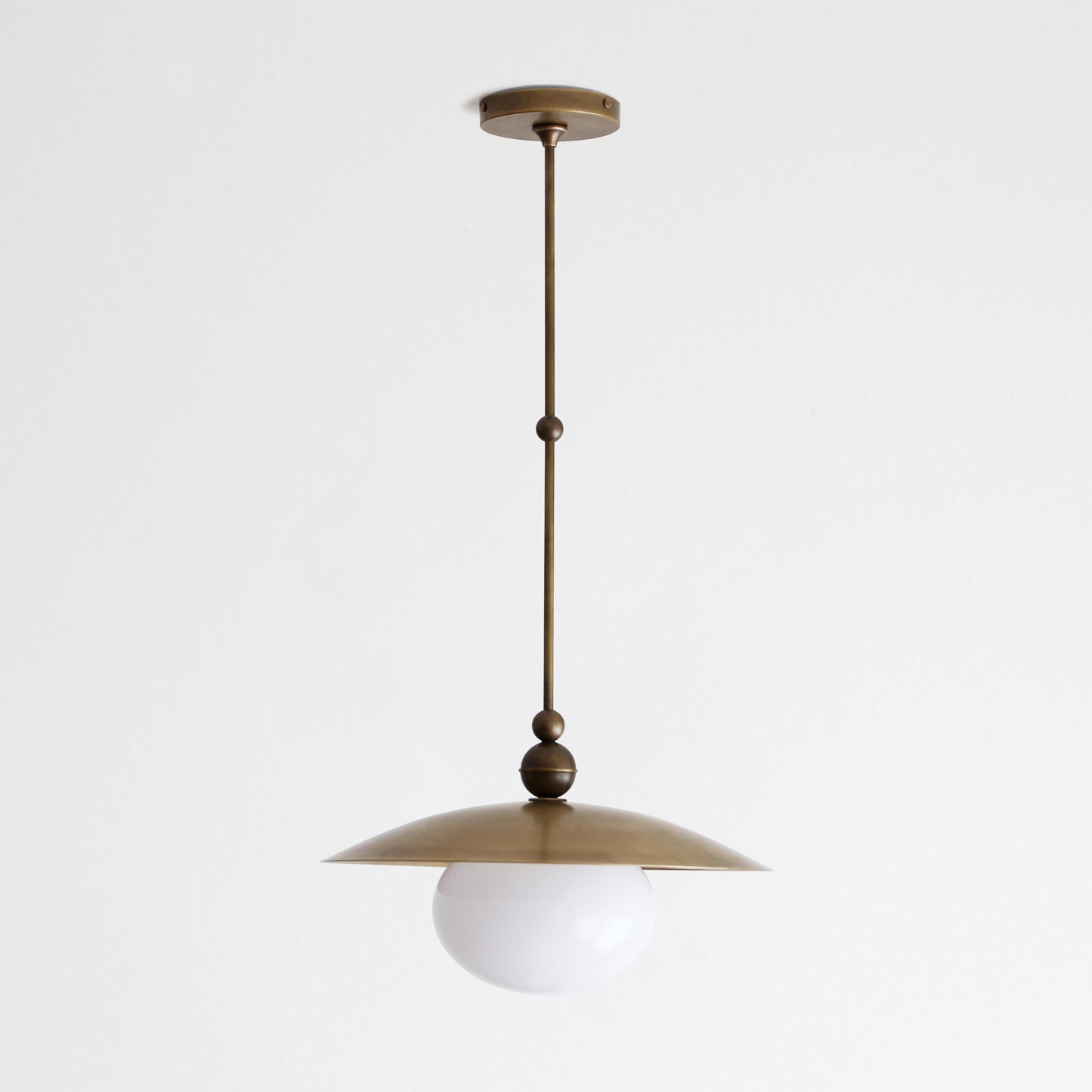 One-Light Rod-Hung Brass Dome Pendant with Opal Glass Globe