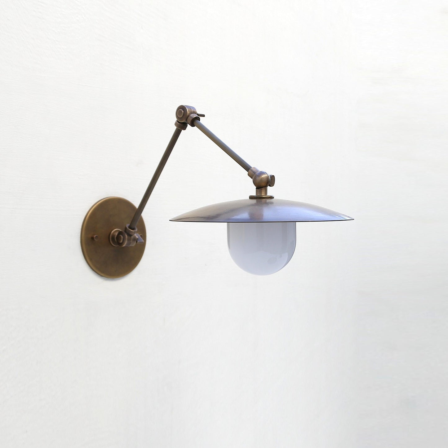 One-Light Swing-Arm Sconce with Brass Disc Shade