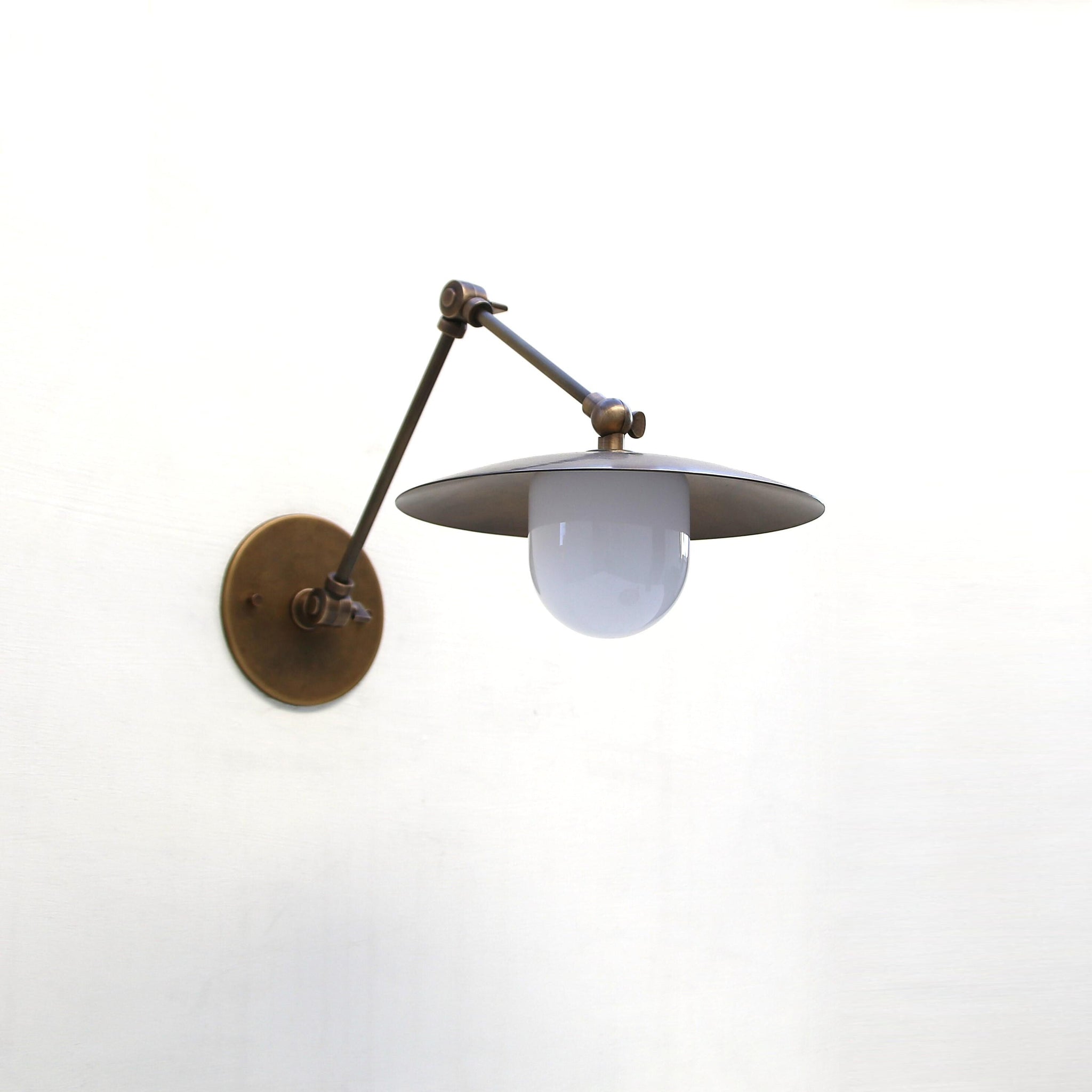 One-Light Swing-Arm Sconce with Brass Disc Shade