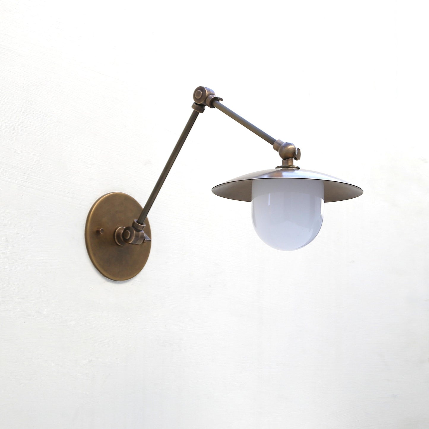 One-Light Swing-Arm Sconce with Brass Disc Shade