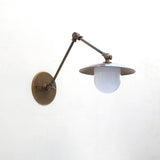 One-Light Swing-Arm Sconce with Brass Disc Shade