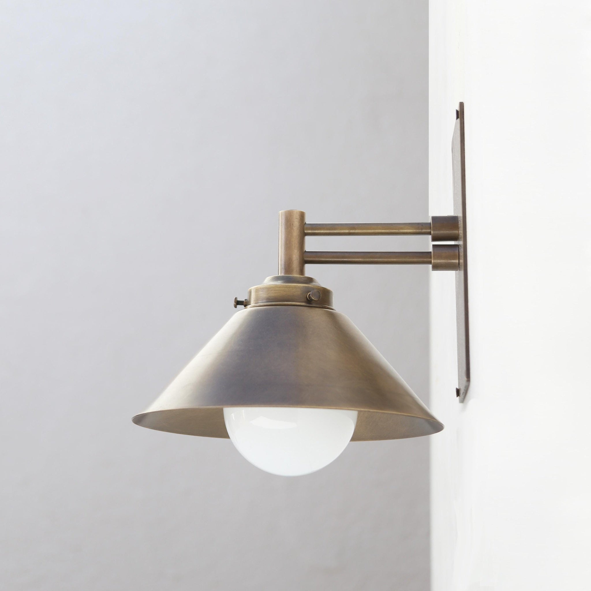 One-Light Swing-Arm Wall Sconce with Brass Cone Shade