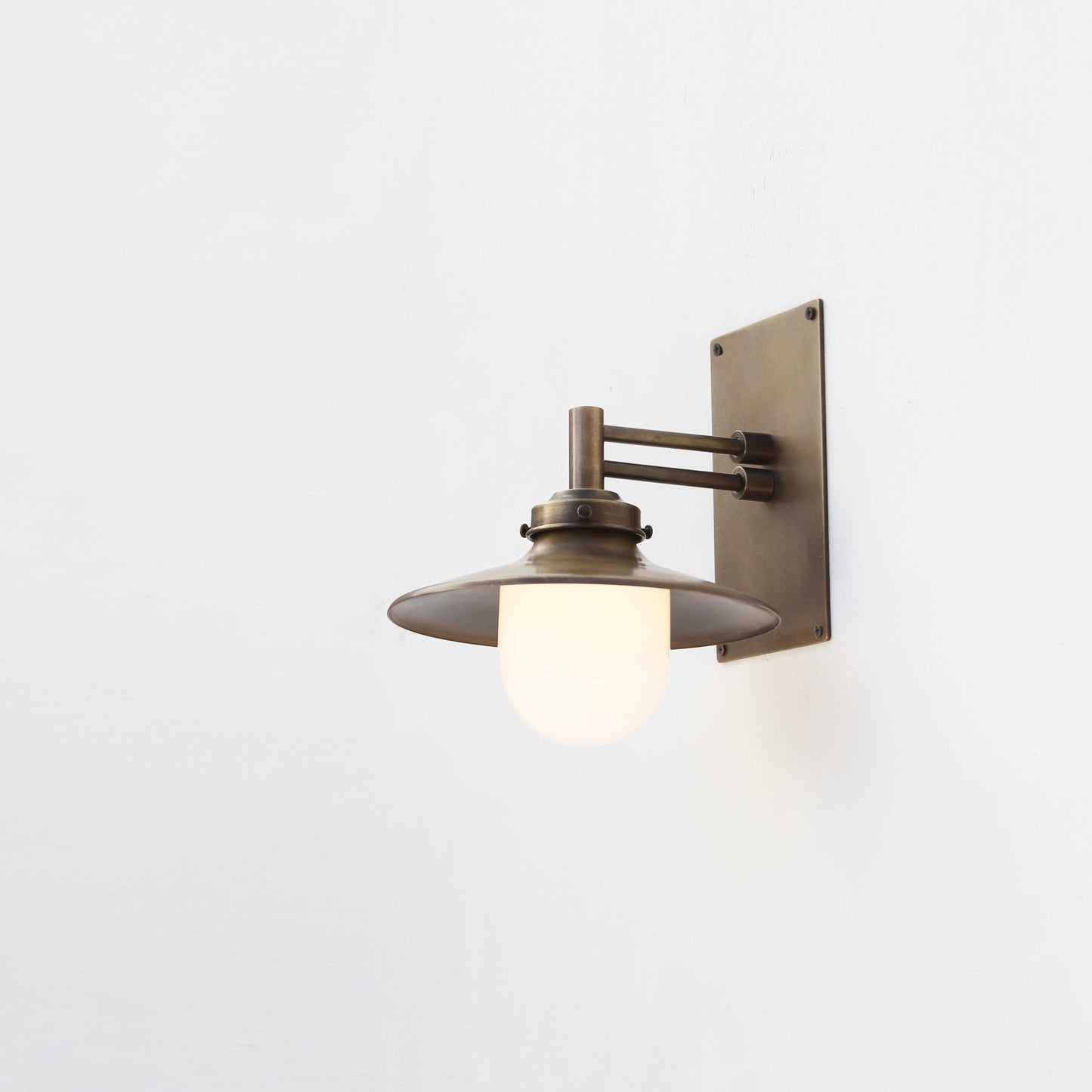One-Light Swing-Arm Wall Sconce with Brass Coolie Shade