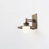One-Light Swing-Arm Wall Sconce with Brass Coolie Shade