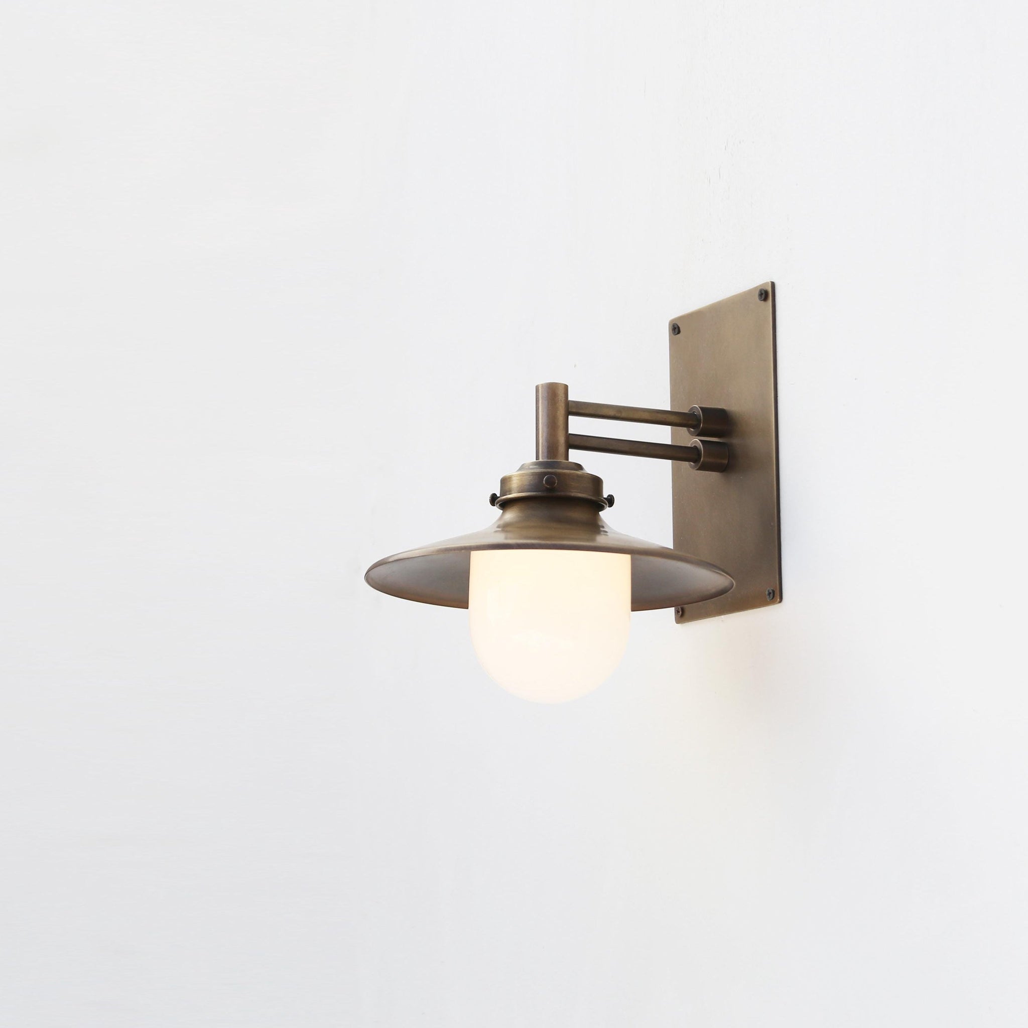 One-Light Swing-Arm Wall Sconce with Brass Coolie Shade