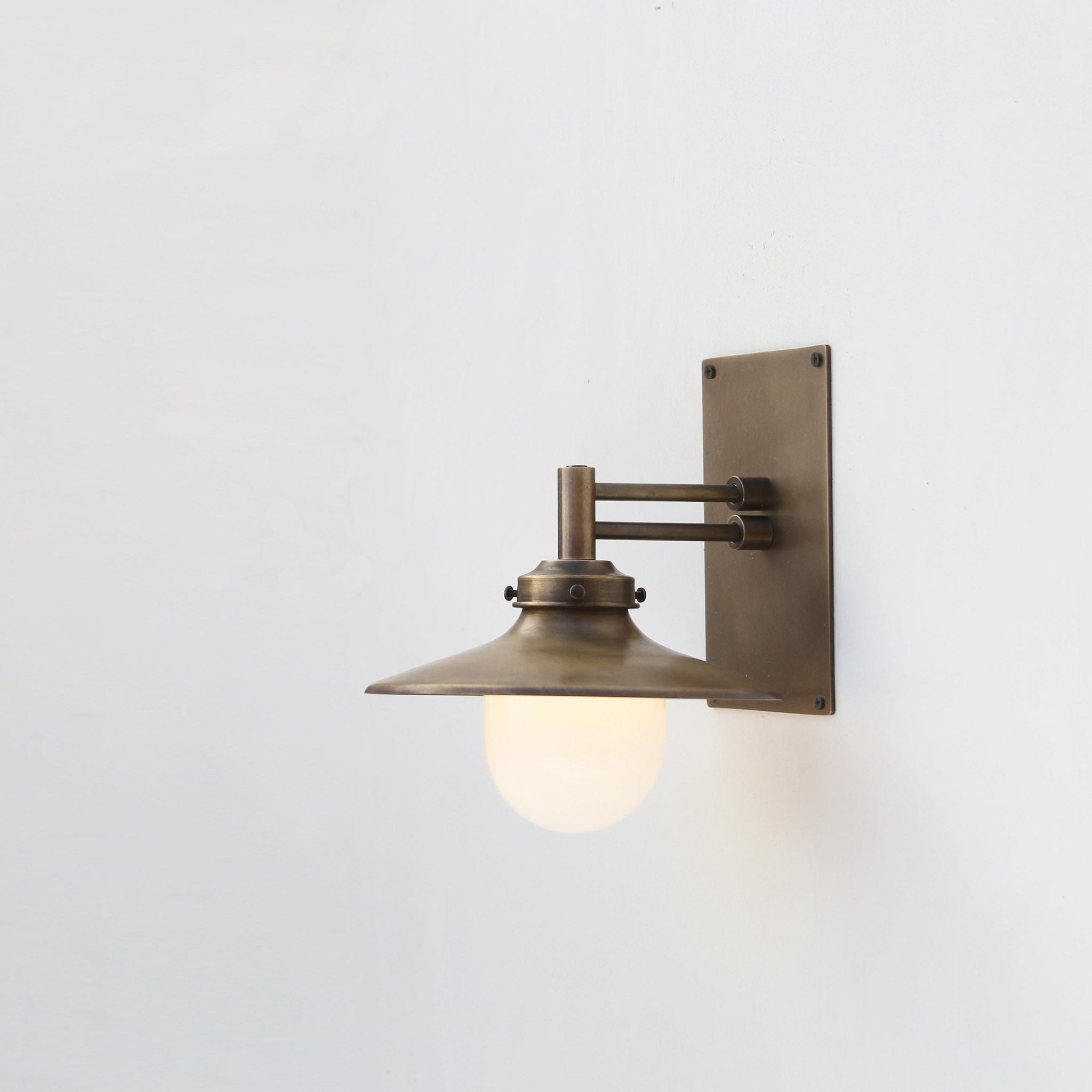 One-Light Swing-Arm Wall Sconce with Brass Coolie Shade