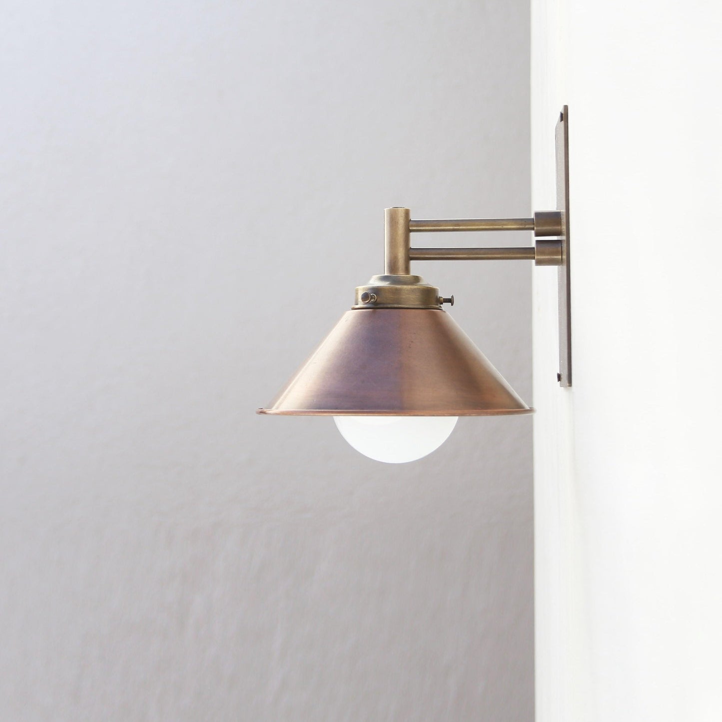 One-Light Swing-Arm Wall Sconce with Weathered Copper Cone Shade